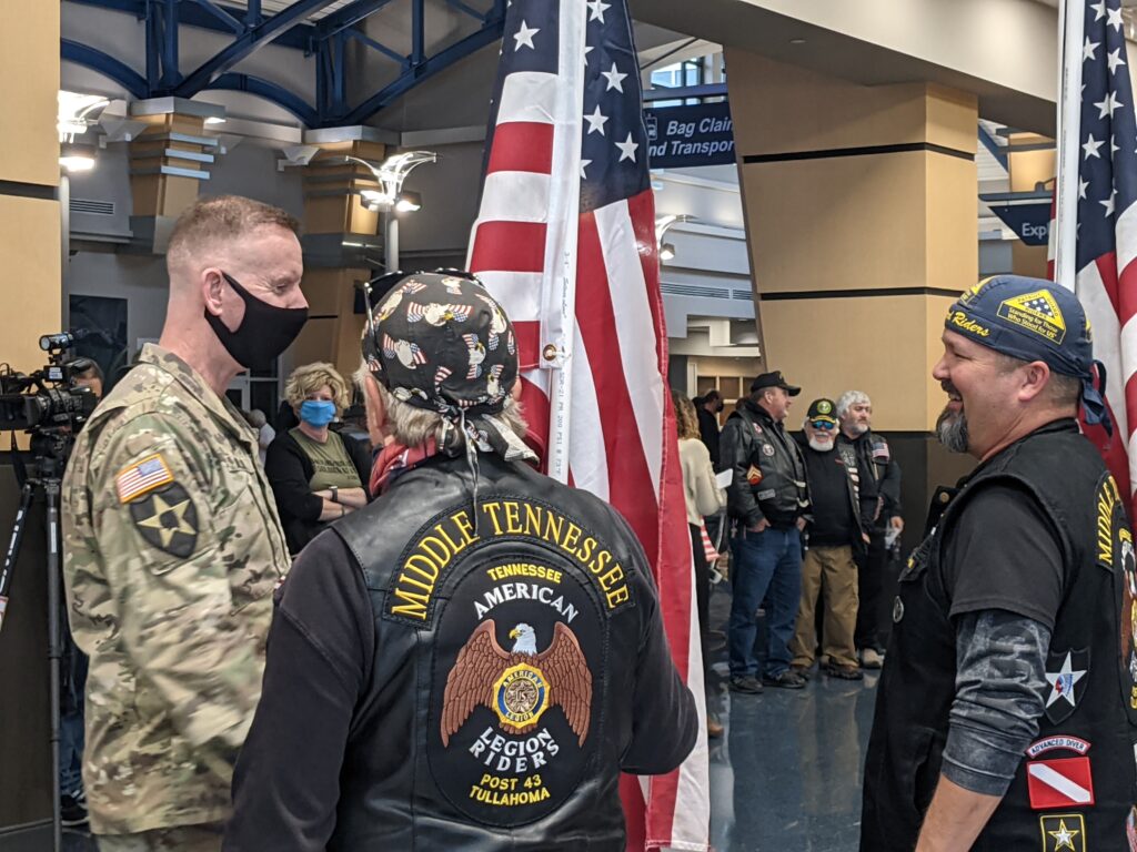A U.S. Army officer greets members of the Middle Tennessee American Legion Riders Post 43 from Tullahoma in town for Heroes Week at Huntsville International Airport